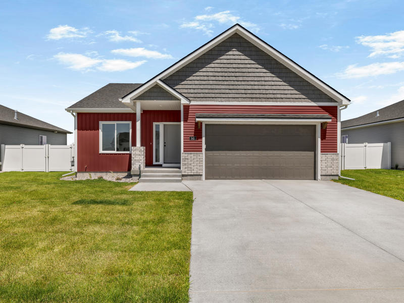 Fully landscaped front yard and walkway at a finished Fox Crossing home